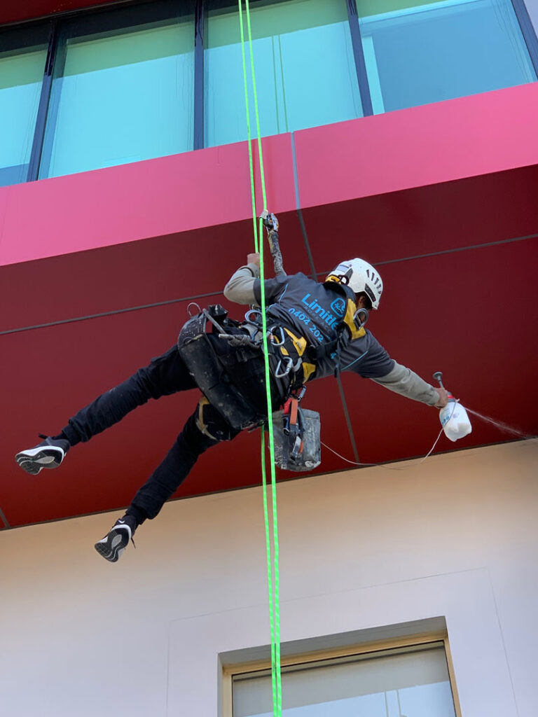 sydney high rise window cleaning red building with pressure was